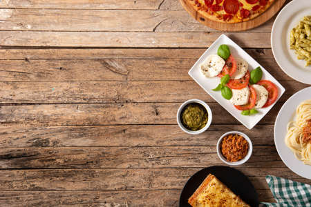 Assortment of Italian pasta dishes on wooden backgroundの写真素材