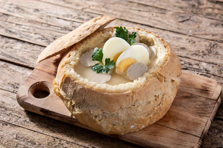 Zurek. Traditional Polish soup on wooden table