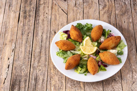 Traditional lebanese kibbeh on wooden tableの写真素材