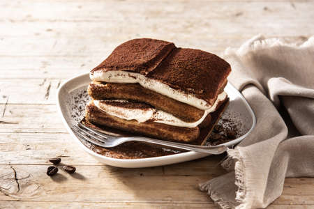 Traditional tiramisu cake on wooden tableの写真素材