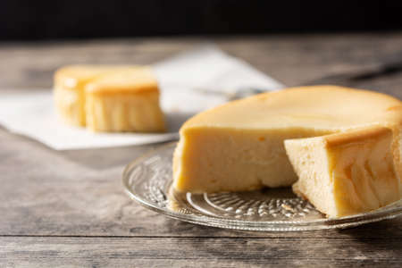Traditional New York cheesecake on wooden tableの写真素材