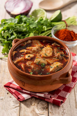 Traditional mondongo or el menudo soup on wooden tableの写真素材