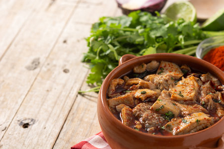Traditional mondongo or el menudo soup on wooden tableの写真素材