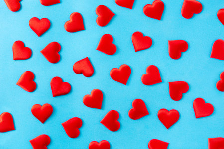 Red hearts pattern on blue background for Valentine's Day