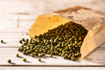 Green soy beans on wooden table.