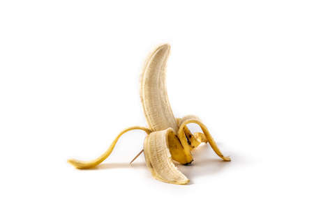 Half peeled banana isolated on white backgroundの写真素材