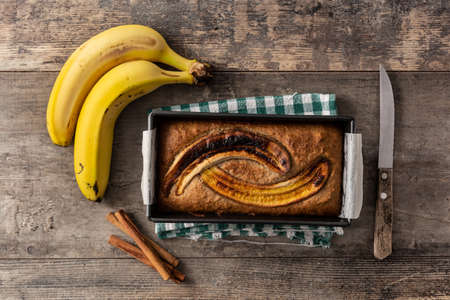 Homemade banana bread on wooden tableの写真素材