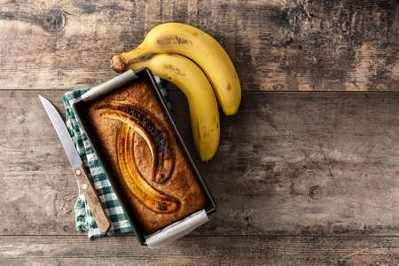 Homemade banana bread on wooden tableの写真素材