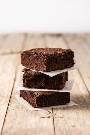 Homemade pieces of brownies on wooden tableの写真素材