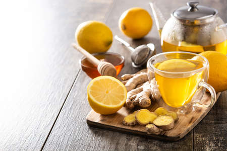 Ginger tea with lemon and honey in crystal glass on wooden table.Copy spaceの写真素材