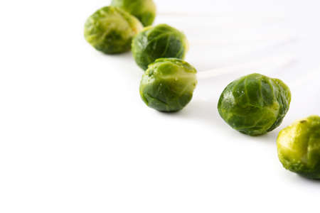 Set of brussel sprouts with lollipop sticks on white backgroundの写真素材