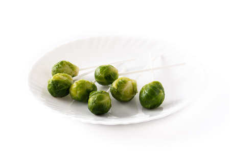Set of brussel sprouts with lollipop sticks on white backgroundの写真素材