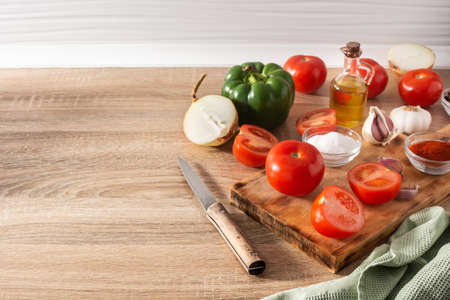 Preparing tomato sauce in the kitchen. Ingredients on the kitchen counterの写真素材