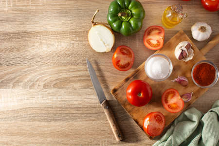 Preparing tomato sauce in the kitchen. Ingredients on the kitchen counterの写真素材