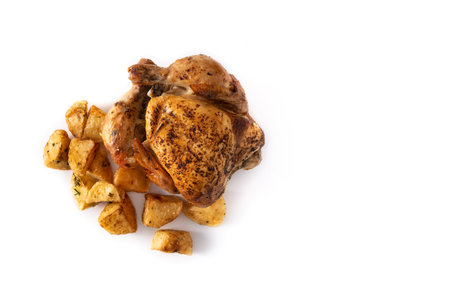 Homemade roasted chicken with potatoes isolated on white backgroundの写真素材