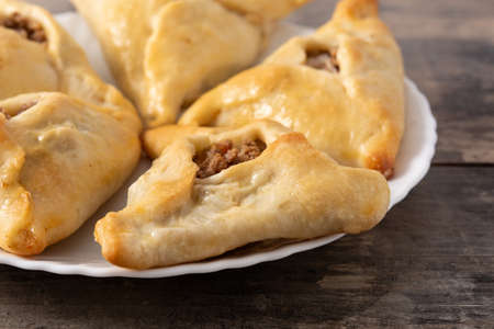 Traditional middle eastern fatayer on wooden tableの写真素材