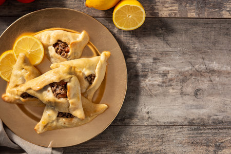 Traditional middle eastern fatayer on wooden tableの写真素材