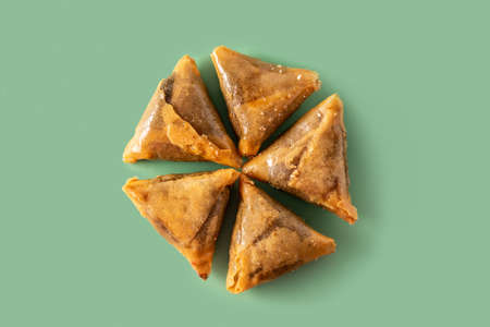 Almond briwat on green background. Traditional Moroccan dessertの写真素材