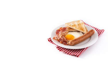 Traditional American breakfast with fried egg, toast, bacon and sausage isolated on white backgroundの写真素材