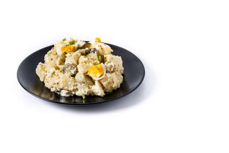 Potato salad with gherkings, egg and mustard isolated on white backgroundの写真素材