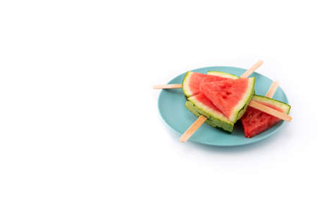 Watermelon slices on blue plate isolated on white background. Copy spaceの写真素材