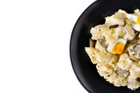 Potato salad with gherkins, egg and mustard isolated on white backgroundの写真素材
