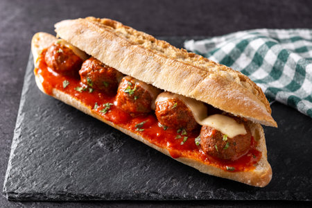 Meatball sub sandwich on black slate backgroundの写真素材
