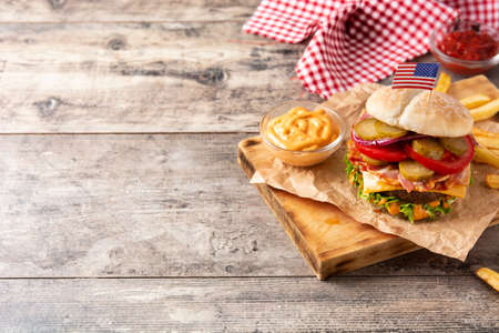 Beef burger with bacon on wooden tableの写真素材
