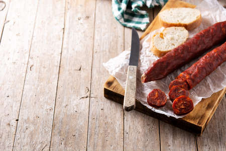 Spanish chorizo sausage on rustic wooden tableの写真素材