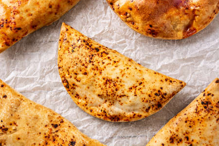Traditional Chilean empanadas on rustic wooden tableの写真素材