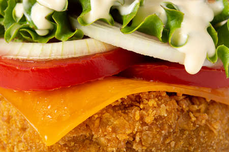 Crispy chicken burger with cheese background. Close upの写真素材