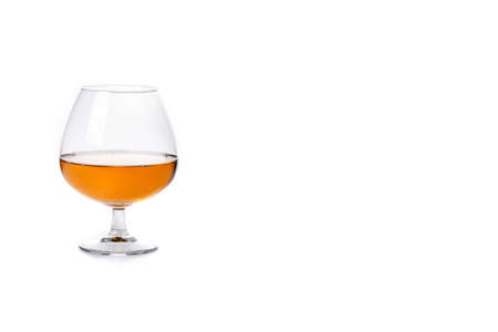 Cognac or whiskey drink isolated on white background. Copy spaceの写真素材