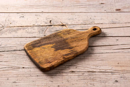 Wooden cutting board on wooden table