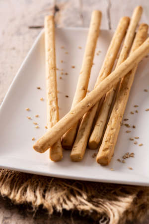 Breadstick grissini snack on wooden table