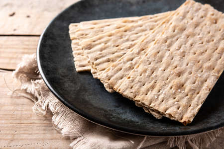 Traditional matzah bread on wooden tableの写真素材