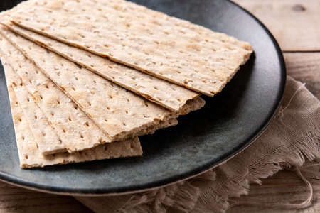Traditional matzah bread on wooden table