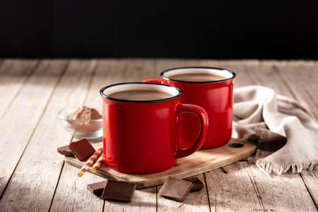 Traditional Mexican chocolate atole drink on wooden tableの写真素材