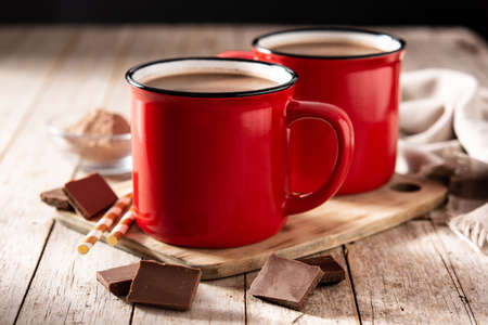 Traditional Mexican chocolate atole drink on wooden tableの写真素材