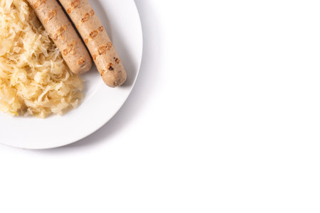 Bratwurst sausage and sauerkraut isolated on white background. typical german foodの写真素材