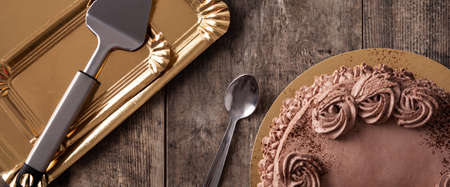Piece of chocolate truffle cake on wooden tableの写真素材