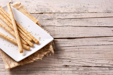 Breadstick grissini snack on rustic wooden tableの写真素材