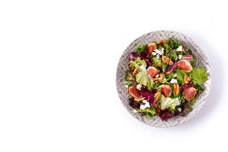 Figs salad with cheese and walnuts isolated on white backgroundの写真素材