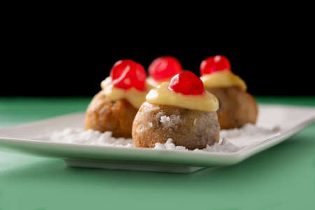Traditional Italian Zeppole pastry on green background