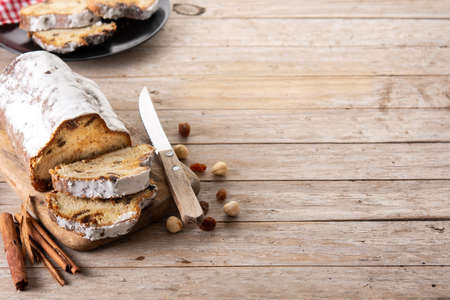 Traditional German Christmas stollen on wooden tableの写真素材