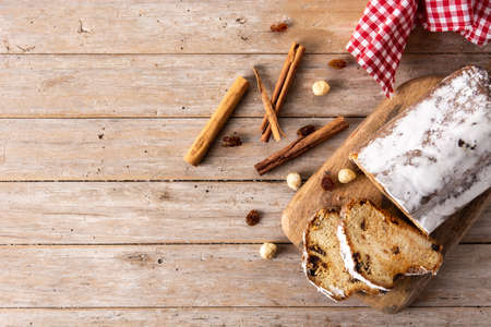 Traditional German Christmas stollen on wooden tableの写真素材