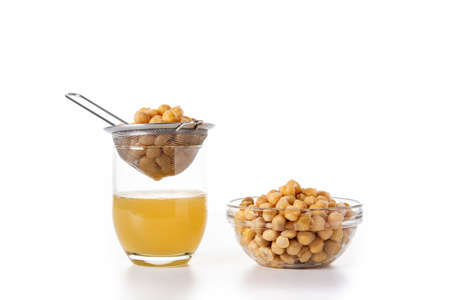Chickpea water aquafaba isolated on white background. Chickpea water is a substitute for eggs in pastriesの写真素材