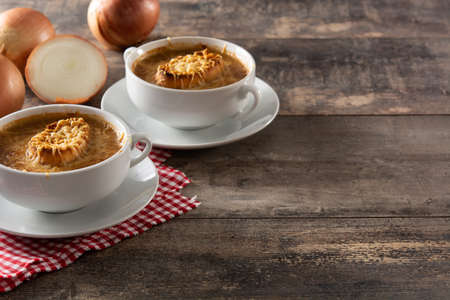 Traditional french onion soup on wooden tableの写真素材
