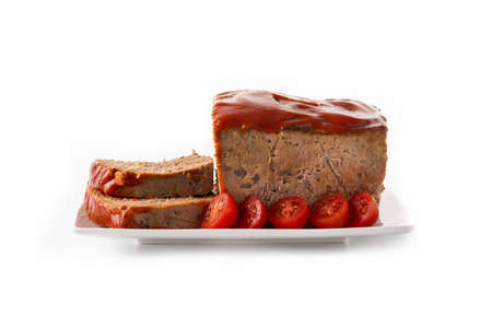 Traditional American meatloaf with ketcup isolated on white backgroundの写真素材