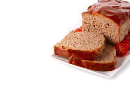 Traditional American meatloaf with ketcup isolated on white backgroundの写真素材