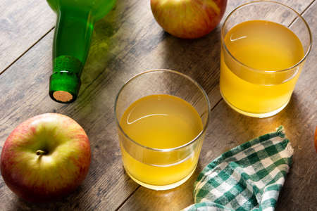 Apple cider drink on wooden tableの写真素材